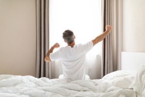 man-stretching-after-waking-up