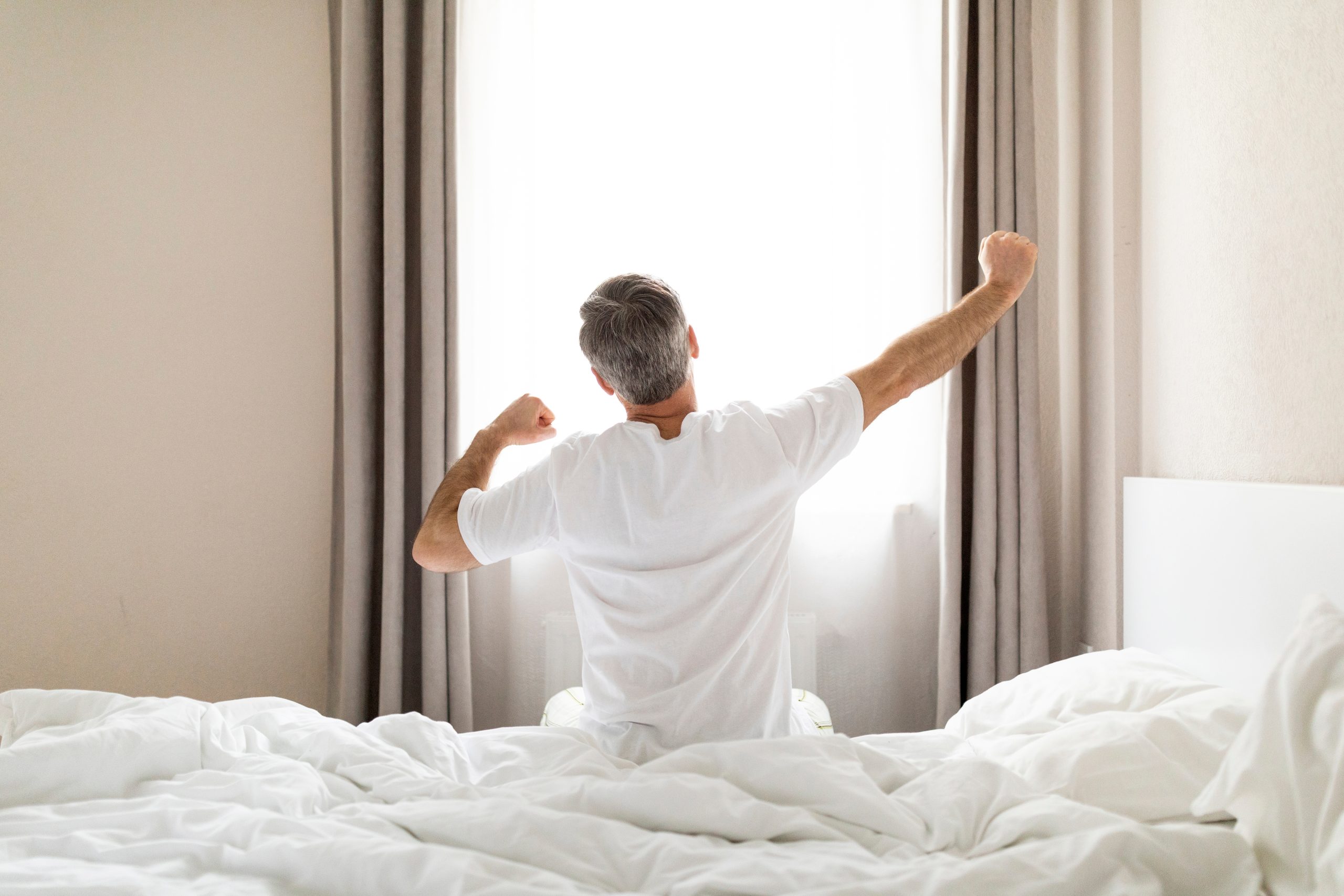 man-stretching-after-waking-up